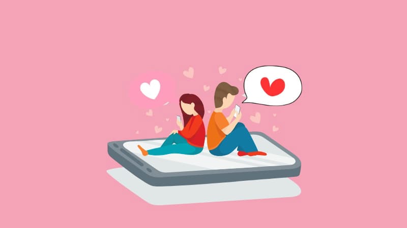 スマートフォンの上に座るカップルが背を向けてスマホを見ており、周囲にたくさんのハートが浮かぶ、出会いの広がりをイメージさせる婚活ビジュアル